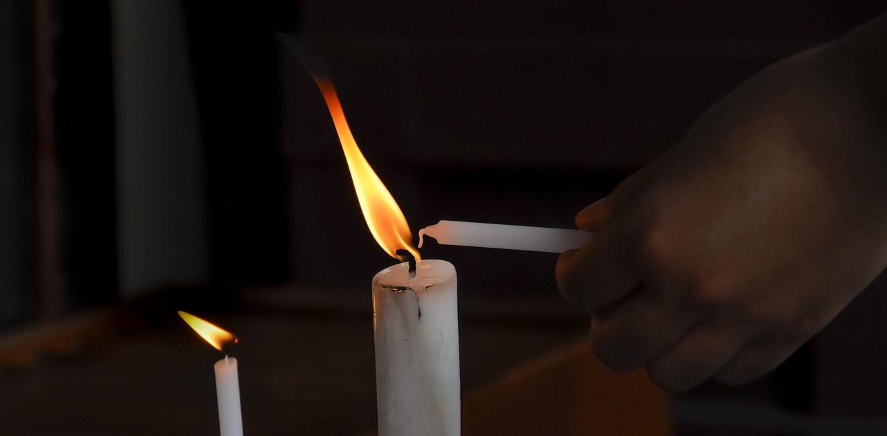 candle maker pouring soy wax in workshop