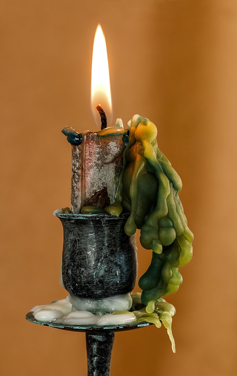 amber candles beside mountain evergreens