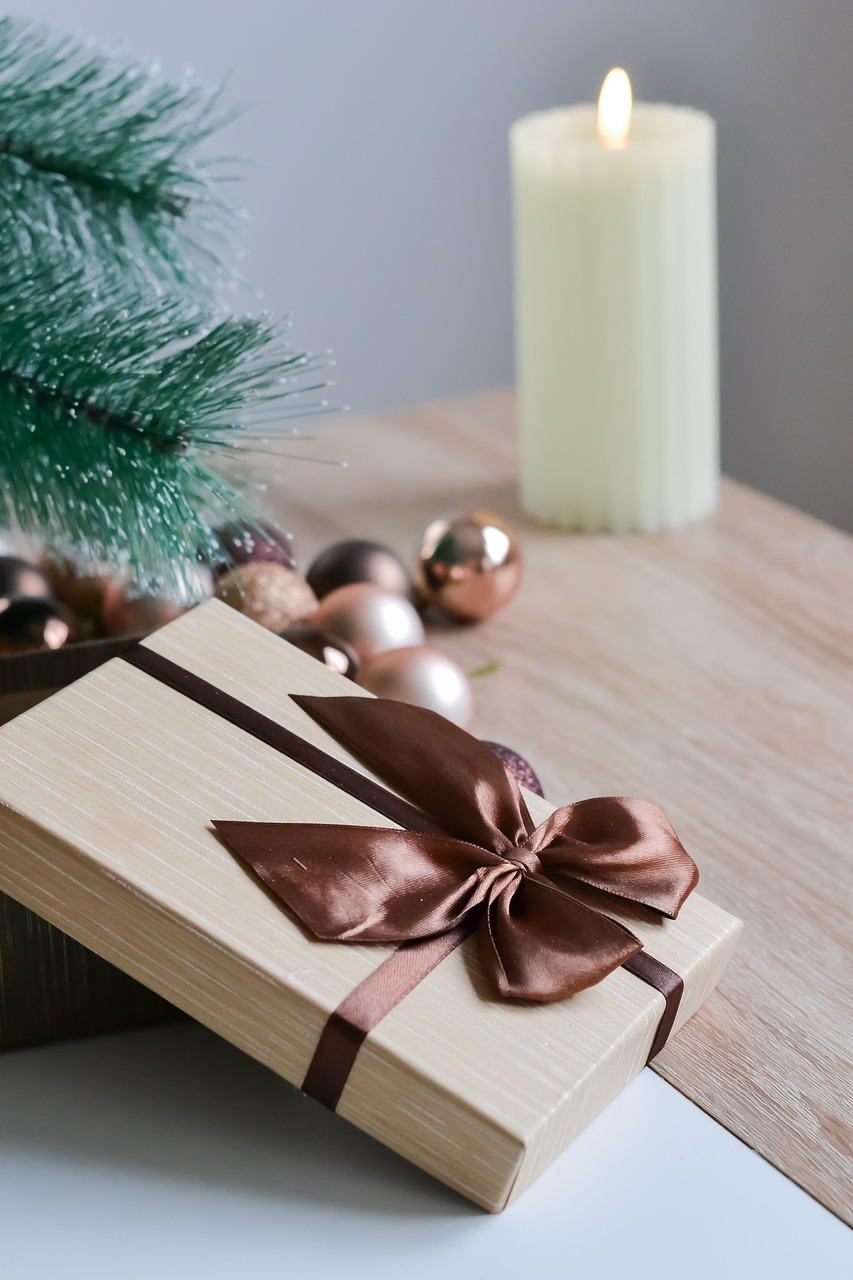 soy candles beside fir branches